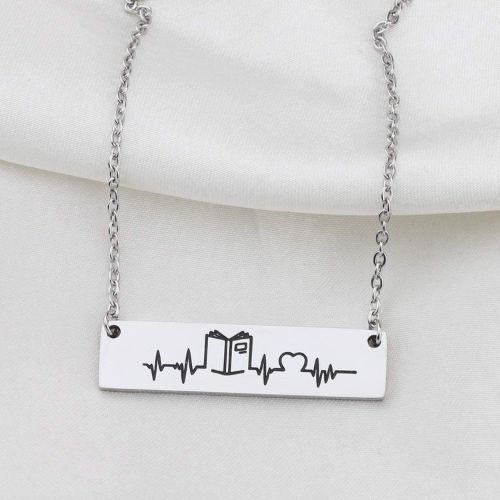 necklace with a book and heartbeat design